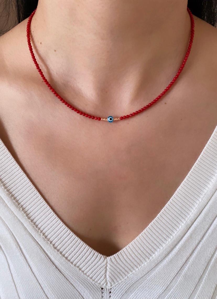 Coral evil eye deals